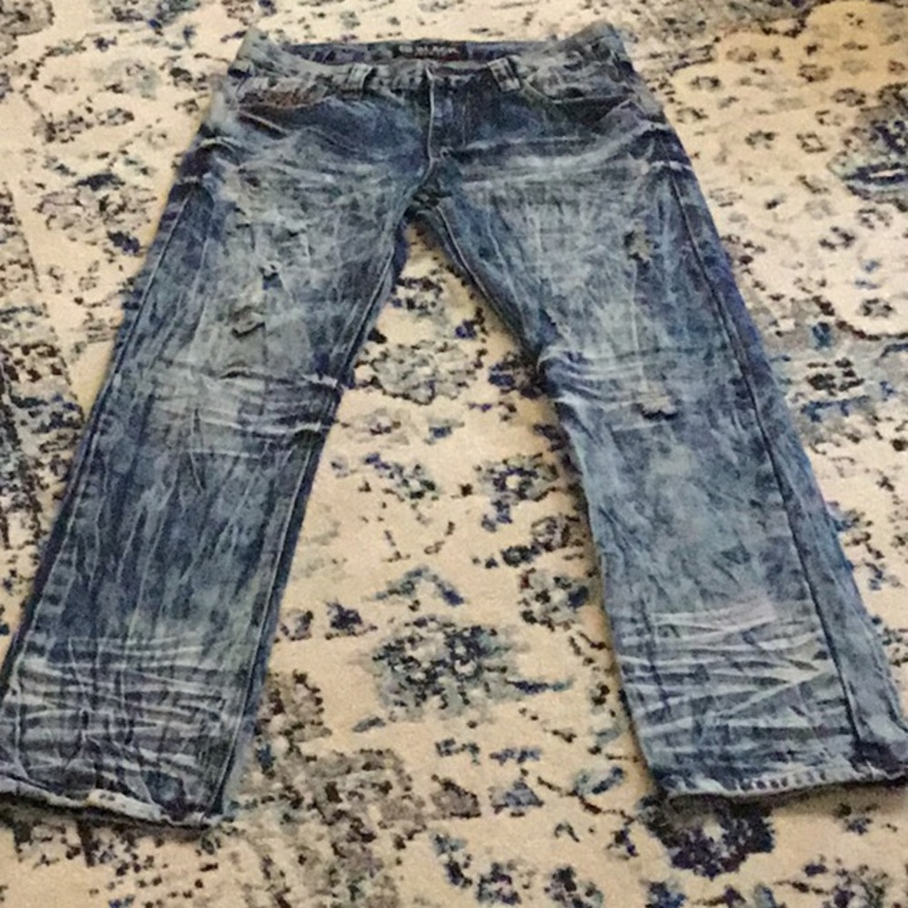 Black Premium brand distressed jeans. 30 by 32.